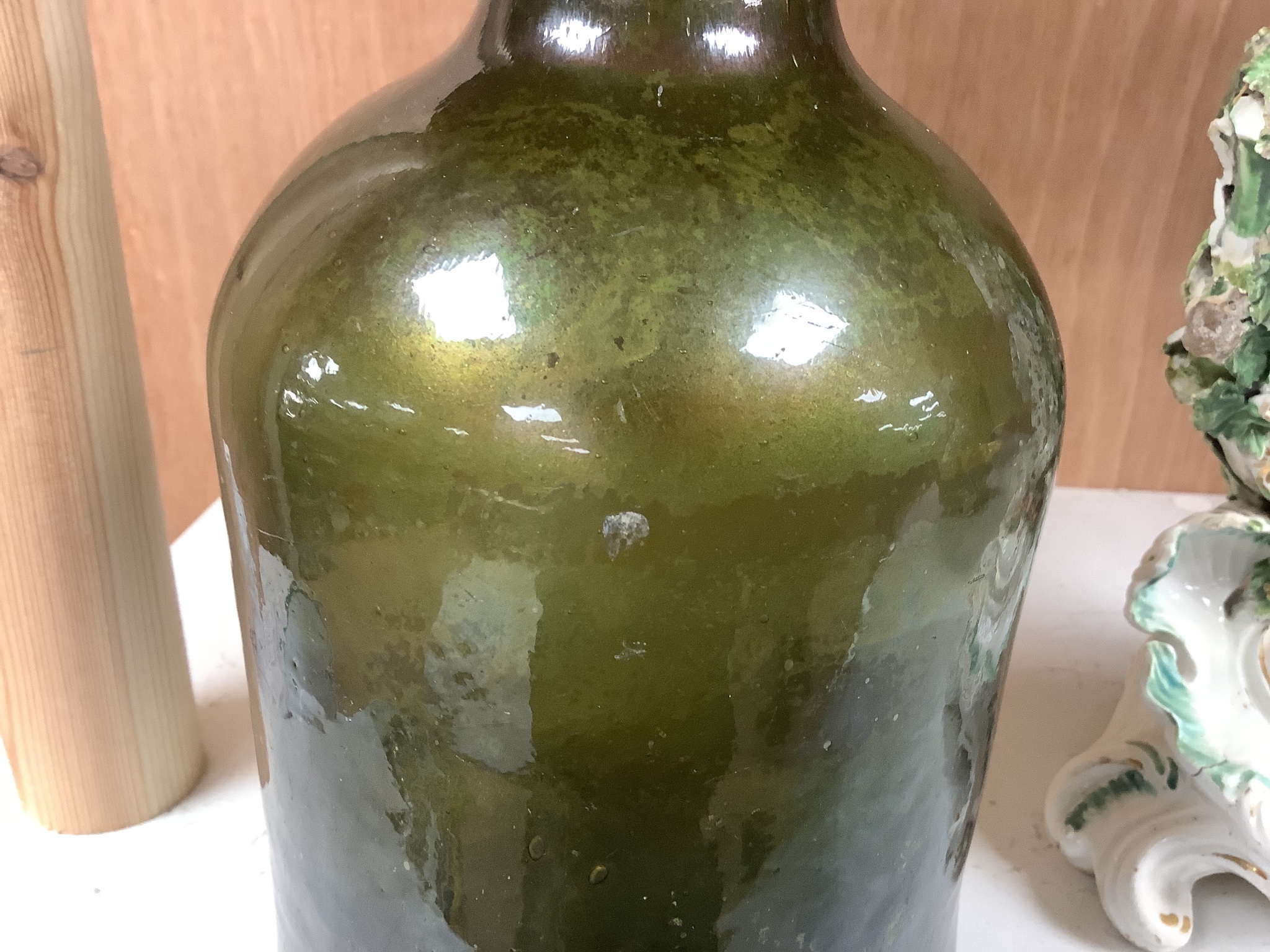 A George III green glass sealed wine bottle, dated 1778 26cm